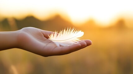 Poster - Delicate Feather Resting on a Hand with a Golden Sunrise in the Background : Generative AI