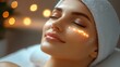 © The Little Hut - Close-up view of a woman enjoying a facial with shimmering highlights enhancing her beauty in a tranquil setting : Generative AI