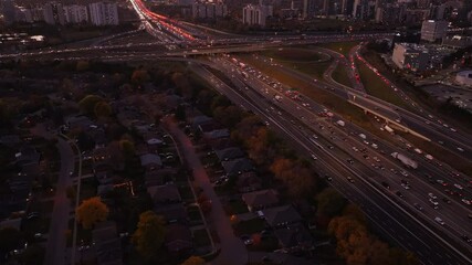 Wall Mural - Highway 401 and 404 in ontario at dusk with heavy traffic flow , aerial view