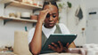 © peopleimages.com - Worried, stress and woman with tablet, reading or disappointed with negative feedback or online. Review, entrepreneur and black person with app for small business, frustrated or tech for social media