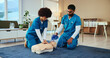 © AchillesReel25/peopleimages.com - Students, cpr or nurses teaching with mannequin for first aid practice, cardiac arrest or safety protocol. Healthcare class, advice or people in medical simulation, paramedic course or nursing school