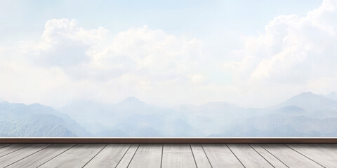 Wall Mural - Scenic view of misty mountains from a wooden platform at dawn