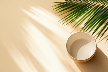 Wall Mural - Empty bowl, palm leaf, sunlit beige background, product display