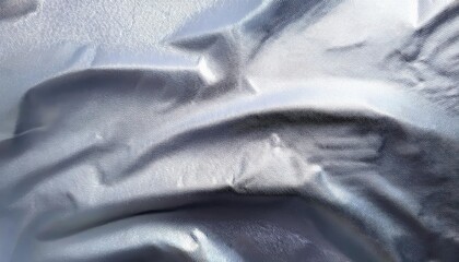 Fototapete - shimmering metallic fabric texture with soft folds for abstract background, futuristic designs, and graphic projects

