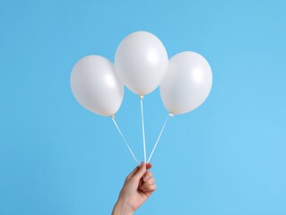 Poster - Vibrant Party Display Hand Holding Trio of White Balloons on Blue Background - Contemporary Event Decor and Celebration Marketing Visual