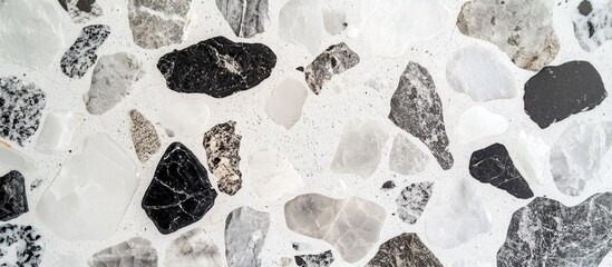 Poster - decorative background of small black gray and white stones for use in design and architectural proje