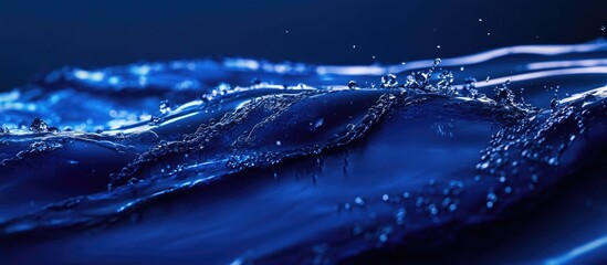Poster - Vibrant Macro Water Splash in Deep Blue Liquid with Space for Text or Branding Elements