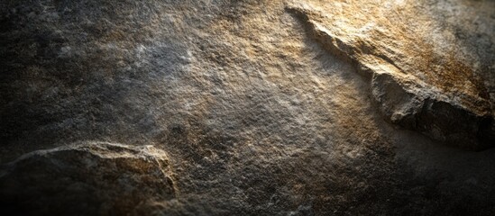 Poster - Textured stone surface with natural patterns and highlights capturing the essence of rugged terrain and geological formations.