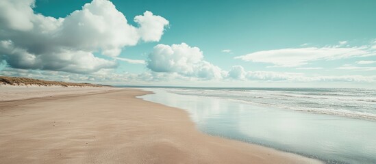 Poster - Serene beach landscape with soft pale sand and turquoise waters under a clear sky, offering ample copy space for text and branding elements.