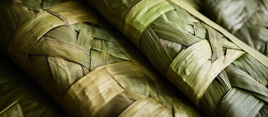 Poster - Textured mats woven from pandanus leaves showcasing intricate patterns and natural green hues for an organic background design.