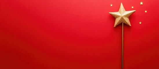 Poster - Magic wand and golden star on vibrant red background for festive and holiday themed creative design or advertising purposes