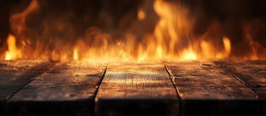 Wall Mural - Rustic wooden table with dynamic flame effects against a dark background for dramatic visual impact and ambiance.