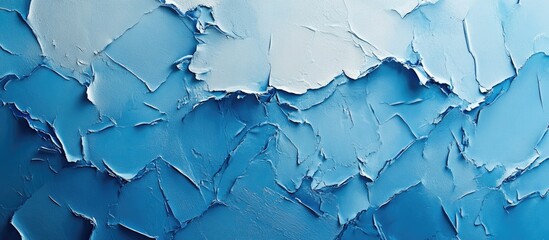 Textured blue wall with scraped paint layers creating an abstract artistic effect ideal for backgrounds in design and interior decor.