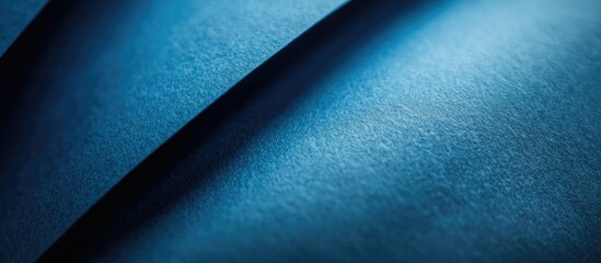 Poster - Detailed close-up of textured blue paper surface showcasing depth and shadows for creative design and artistic applications.