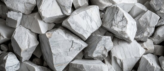 Poster - Grey and white marble stone pieces stacked together featuring natural textures and patterns ideal for construction and design purposes.