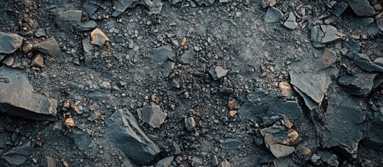 Poster - Close-up of textured grey gravel rock surface showing debris ideal for backgrounds, backdrops, or mapping applications.