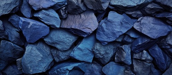 Poster - Blue stone texture background with layered irregular stones showcasing deep hues and unique shapes for natural aesthetic designs.