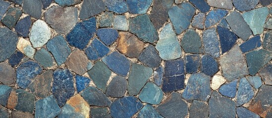 Poster - Porphyry stone paving texture showcasing a mosaic of blue, brown, and green hues ideal for architectural and design backgrounds