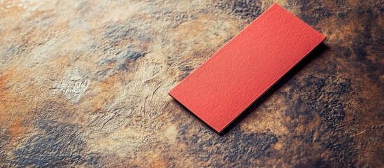 Poster - Vintage textured paper background featuring a red bookmark, ideal for showcasing text space and design elements in your projects.