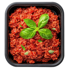 A red and green dish with a basil leaf on top