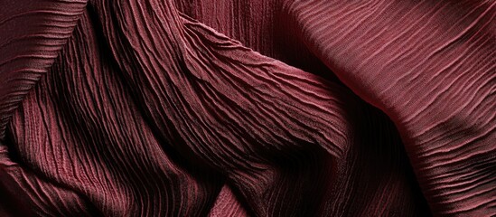 Poster - Textured red fabric draped in elegant folds showcasing depth and richness in color ideal for fashion or interior design backgrounds.