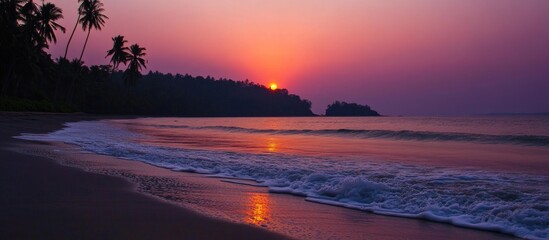 Poster - Vibrant summer sunset over tranquil sea waves with palm silhouette creating a serene tropical ambiance along the shoreline.
