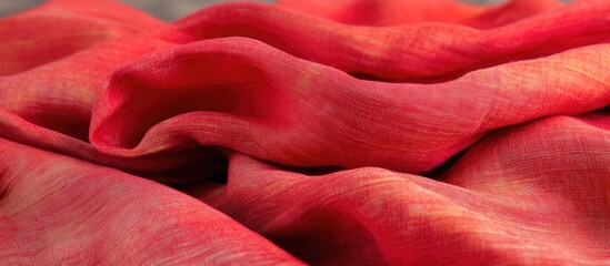 Poster - vibrant red fabric draping elegantly, showcasing rich texture and soft folds ideal for diverse creat