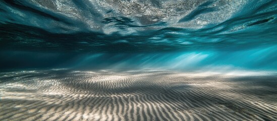 Aufkleber - Underwater beach sand texture with shimmering light patterns and tranquil blue water reflections in a serene marine environment