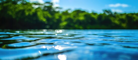 Aufkleber - Tropical water surface with vibrant reflections and ripples under a clear blue sky in a natural setting