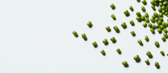 Aufkleber - Scattered green mung beans creating a natural texture on a minimalist white background ideal for healthy food concepts and nutrition themes
