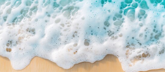 Aufkleber - Sea foam texture on sandy beach with turquoise water high quality abstract natural background for environmental and travel themes