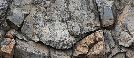 Aufkleber - Granite rock texture surface featuring rough and smooth stones in natural earthy tones suitable for backgrounds and design projects