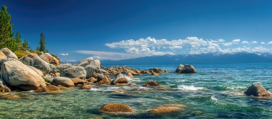 Aufkleber - Serene coastal landscape featuring rocky shoreline and clear blue waters under a vibrant sky with clouds and distant mountains