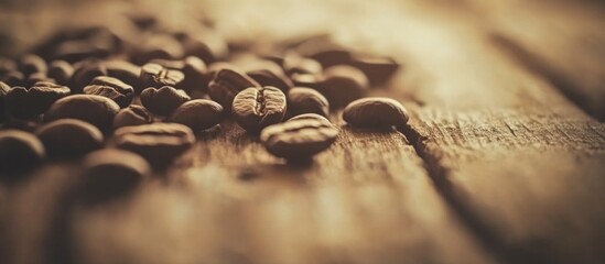 Poster - Close-up of scattered coffee beans on a rustic wooden surface creating a warm and inviting atmosphere for coffee enthusiasts