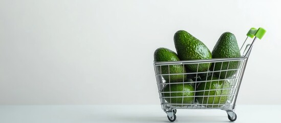 Poster - Fresh avocados in a shopping cart with empty space for text ideal for healthy eating concepts and organic food marketing
