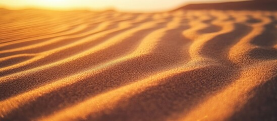 Aufkleber - Brown desert sand texture close-up with ripples illuminated by warm sunlight creating a tropical beach pattern.