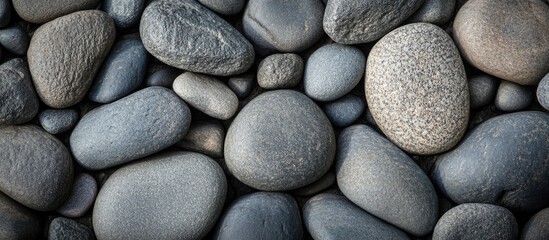 Aufkleber - Smooth gray pebbles texture background featuring a variety of sizes and shapes ideal for nature or design concepts and projects.