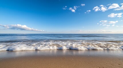 Canvas Print - An expansive view of the calm ocean waves gently washing onto a sandy shore under a clear sky : Generative AI