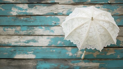 Poster - A charming lace parasol placed against a distressed wooden backdrop