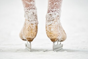 Aufkleber - A pair of ice skates resting in the snow, ready for use