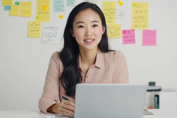 Wall Mural - A person sitting in front of a laptop computer, possibly working or browsing