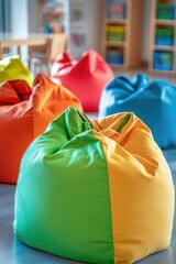 Aufkleber - A group of bean bags sitting on top of a table, great for a casual gathering or indoor decor
