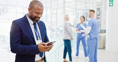 Poster - Happy, businessman or investor with phone for medical funding, online investment or healthcare campaign at hospital. Man, board director or shareholder with smile on mobile smartphone for health app