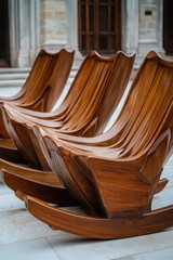 Poster - A row of wooden chairs sitting on a stone floor, perfect for rustic or vintage-themed settings