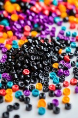 Poster - Close-up of a pile of colorful beads arranged on a white surface