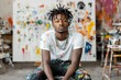 © Odin AI - Young male artist posing in a vibrant studio filled with colorful paint splatters and creative expression