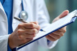 © Jen - Hands, prescription and writing with doctor in hospital, closeup for checklist or medical aid. Clipboard, diagnosis and document with healthcare professional person in clinic for planning or research