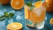 © Erisna Yolanda - Refreshing orange fizz drink with ice and mint. Summer beverage