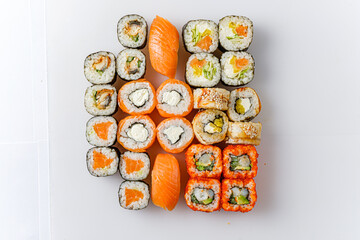 Wall Mural - Delightful Arrangement of a Vibrant Sushi Set Showcasing Fresh Ingredients on a Pristine White Background in a Culinary Masterpiece