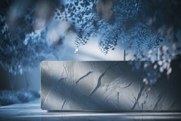 Poster - A textured grey stone countertop sits under a blurred, blue-toned leafy plant.